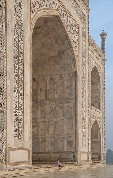 Woman sits next to the Taj Mahal. by Floyd Angenent