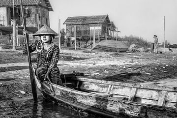 Girl operates the ferry on the river in Mandalay. At various places in Mandelay should make use of t by Wout Kok