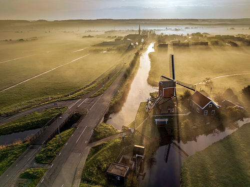 Golden Mist Over a Dutch Windmill