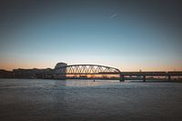 Train on Snelbinder at Nijmegen at sunset