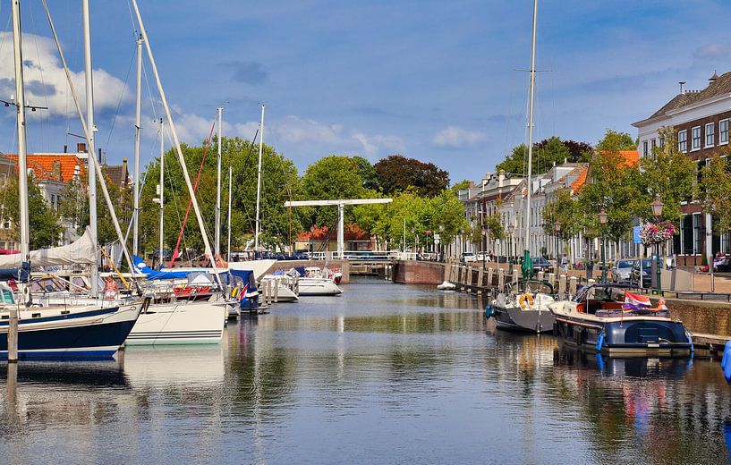 Sail boats lie in the historical harbor of Goes, The Netherlands by Jan Kranendonk