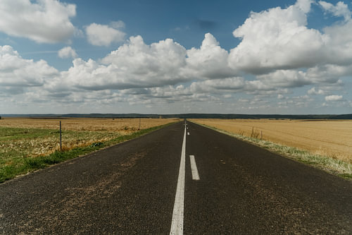 Endless Road Beneath a Dramatic Sky