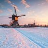 Winter sunrise at the windmills of Kinderdijk by Ilya Korzelius