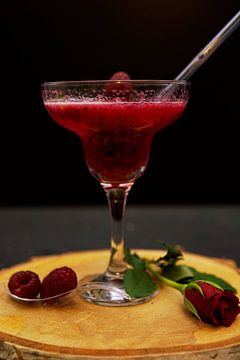 Raspberry puree with sparkling wine in a glass. by Babetts Bildergalerie