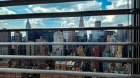 Midtown Manhattan seen through a window blind