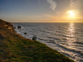 Sunset at Ahrenshoop cliff line van Jörg Hausmann