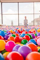 Child playing in ball pit