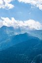 Morning light in the French alps. Soft blue layers of mist and clouds. by Christa Stroo photography thumbnail