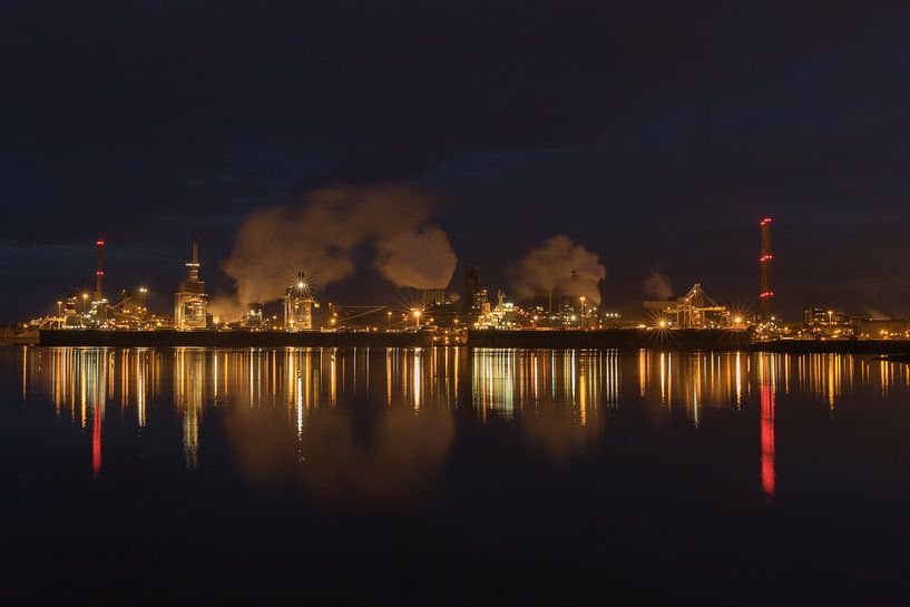 Blast furnaces Tata Steel IJmuiden at night with reflection in water by Fred Hiemstra