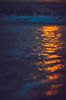 reflectie van ondergaande zon op golvend zeewater van Margriet Hulsker thumbnail