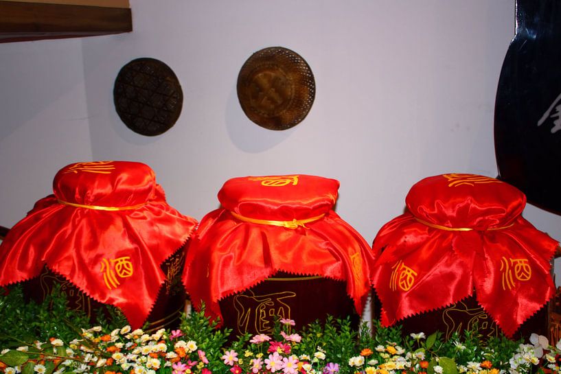 Chinese ceramic wine jars with red satin covers by Loretta's Art