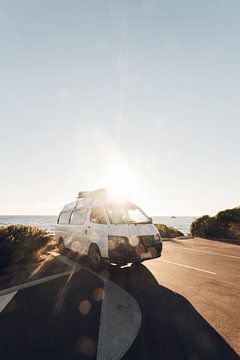 A motorhome parked along the coast at sunset in Australia