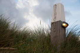 A pole in the beach dunes