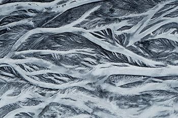 Abstract Aerial View of Frozen River Patterns in Iceland