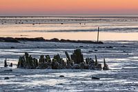 Sonnenaufgang über dem Wattenmeer von der Watteninsel Terschelling an einem Wintermorgen