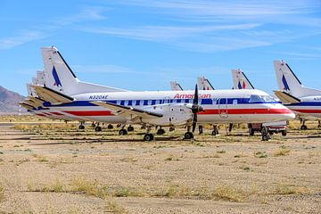 American Eagle Saab 340B stored in desert. by Jaap van den Berg