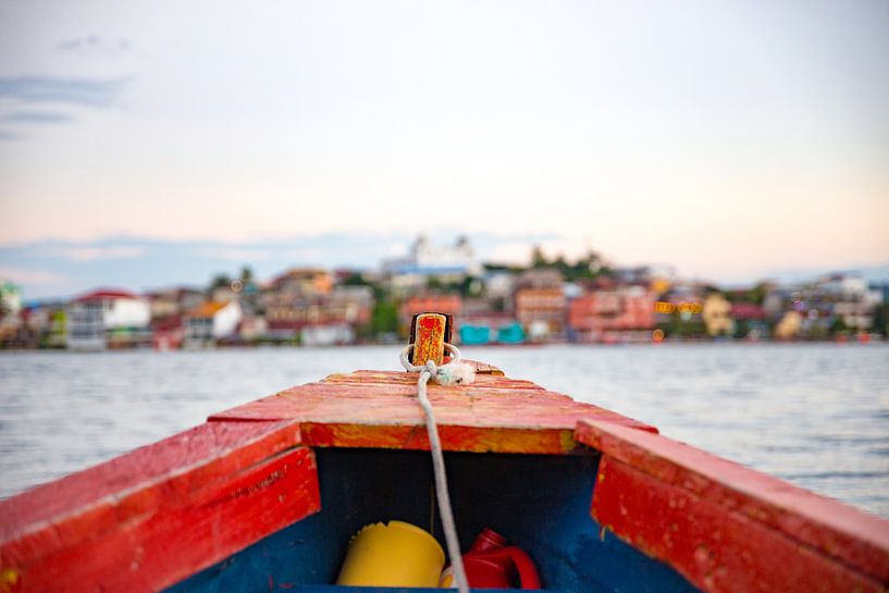 On a boat traveling to the colorful Flores in Guatemala by Michiel Ton