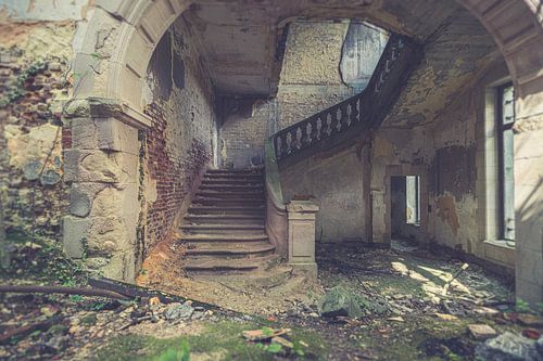 An old stairwell of a dilapidated castle.