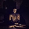 Mysterious Buddha in cave by Eddie Meijer