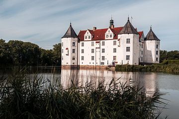 Glücksburg moated castle in the morning light with reflection
