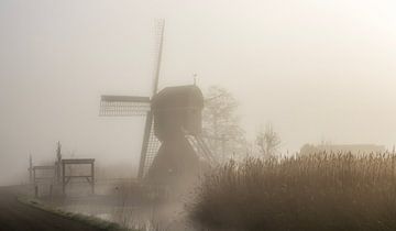 Dutch mill in the fog by Connie de Graaf