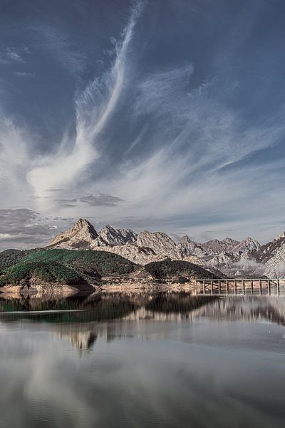 Lake Riano in northern Spain on a windless day by Harrie Muis
