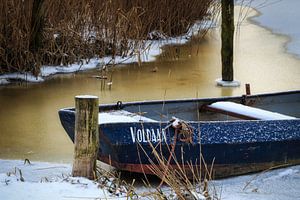Rowing boat frozen in ice by Peter Bolman