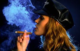 Cool girl smoking a cigar by Matthias Stolt