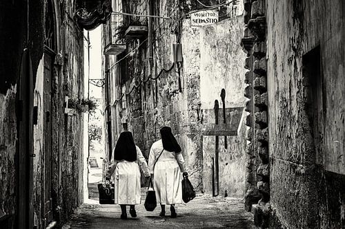 Italian nuns in a picturesque street in southern Italy