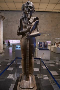 large statue of Khonsu ( the ancient Egyptian god of the Moon) at  National Museum of Egyptian Civil by Mohamed Abdelrazek