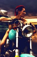 Naked red-haired young woman on motorbike at sunset (woman on motorbike).