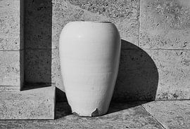 white vase against white wall by . Groningenart