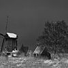 Dutch windmill in winter in black and white by Peter Bolman