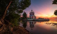 reflection of church in russia on water during sunset