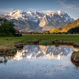 Reflection of the Wetterstein mountains in a small pond by Markus Weber