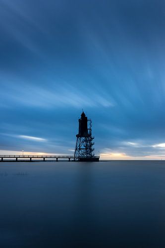 Lighthouse on the North Sea at sunset