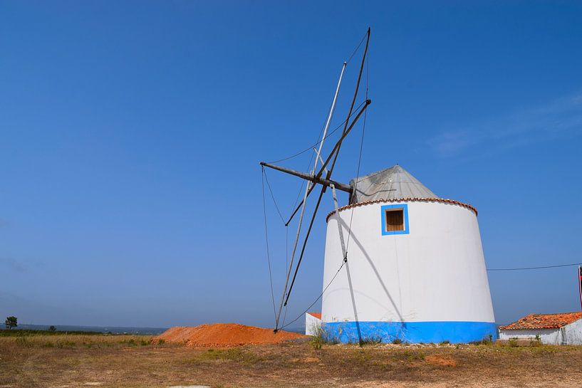 Rustic, colourful windmill in the Portuguese countryside by Studio LE-gals