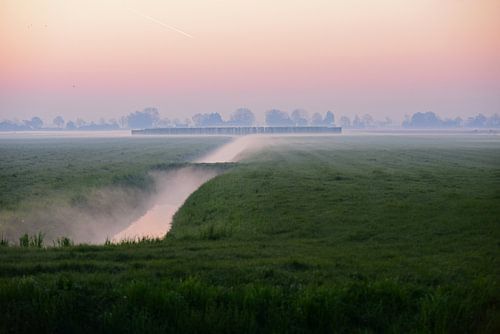 Misty morning in the Dutch countryside with canal, fields and the moon by Nfocus Holland