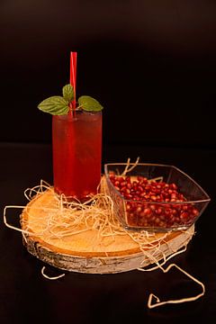 Granaatappel-cranberry-sinaasappel likeur cocktail.