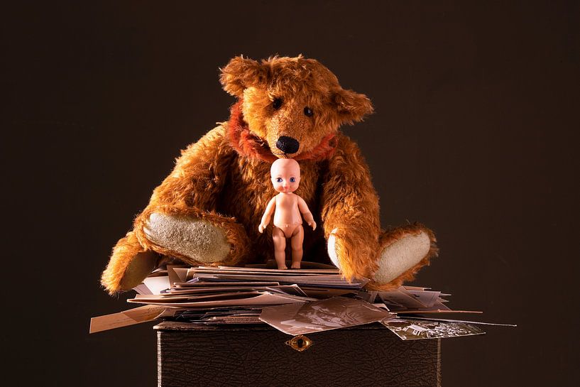 Teddy bear with an old doll and old pictures by Willy Sengers