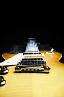Vintage rock guitar on a dark background, selective focus on the