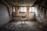 Dilapidated room with chair