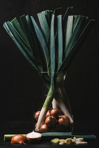 A still life of a bouquet of leeks and onion