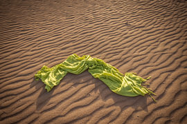 A green scarf with a wavy sand pattern by Harald Bader Photography