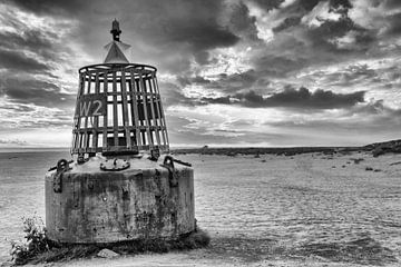 Sea buoy on the beach by Dennis Schaefer