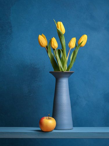 Five yellow tulips in a blue vase