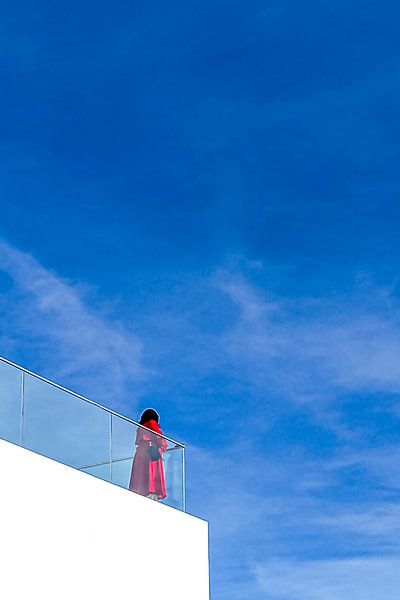 Longing of the woman in red by Dieter Walther