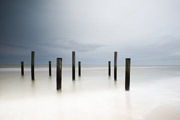 Piles in sea at petten by peterheinspictures