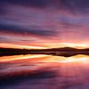 Sonnenaufgang hinter einem schwedischen See von Arjen Roos
