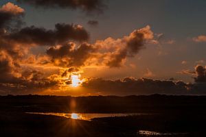 Sonnenuntergang mit Spiegelung über dem Slufter